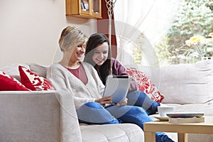 Mother and daughter on tablet computer