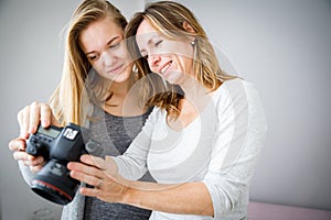 Mother and daughter taking photos