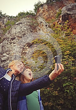 Mother and daughter taking selfie