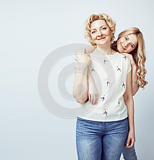 Mother with daughter together posing happy smiling isolated on white background with copyspace, lifestyle people concept