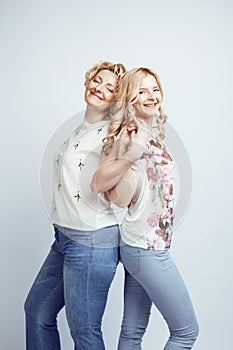 Mother with daughter together posing happy smiling isolated on white background with copyspace, lifestyle people concept