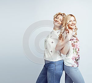 Mother with daughter together posing happy smiling isolated on white background with copyspace, lifestyle people concept