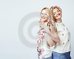 Mother with daughter together posing happy smiling isolated on white background with copyspace, lifestyle people concept