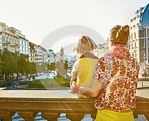 Mother and daughter tourists exploring attractions in Prague