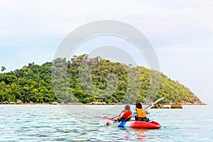 Mother and daughter travel by kayak at Ko Lipe, Thailand