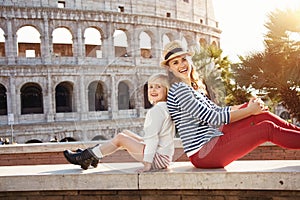Mother and daughter travellers near Colosseum in Rome, Italy