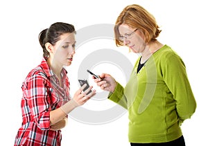 Mother and daughter uses their mobile phones