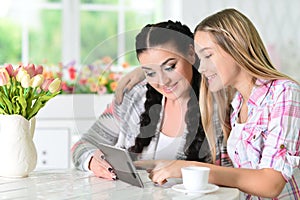 Mother and daughter using tablet