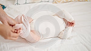 Mother and daughter wearing pyjama lying on bed at bedroom