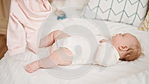 Mother and daughter wearing pyjama lying on bed at bedroom