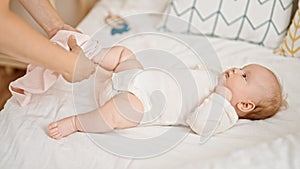 Mother and daughter wearing pyjama lying on bed at bedroom