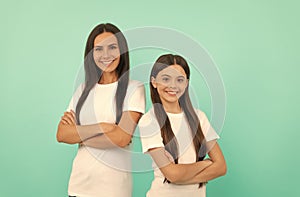 mother and daughter in white shirt. happy childhood and motherhood. concept of friendship.