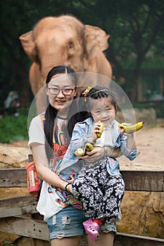 Mother and daughter in zoo