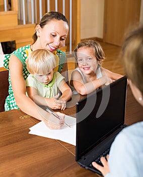 Mother and daughters with social worker