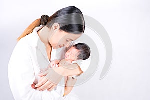 Mother day concept. The mother held the baby in her hand. Mom holding small baby. Woman hands holding newborn baby