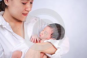 Mother day concept. The mother held the baby in her hand. Mom holding small baby. Woman hands holding newborn baby