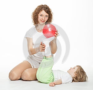 Mother doing sport exercises with daughter