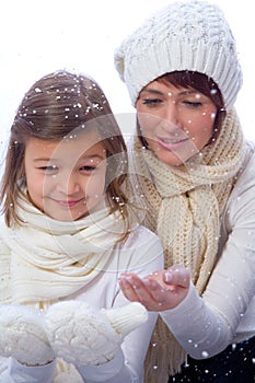 Mother and doughter in warm clothes