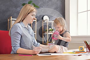 Mother drawing with her daughter