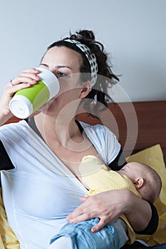 Mother drinks while she breast-feeding