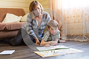 Mother is engaged in training young son.