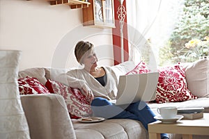 Mother on laptop computer