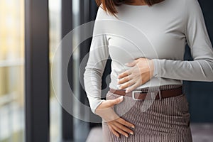 Mother expecting woman holding hand on belly touching pregnancy baby child birth health care life body care healthy pain