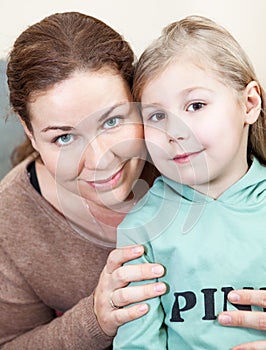 Mother face to face with preschooler daughter