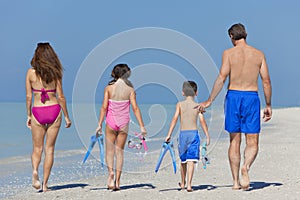 Mother, Father & Children Family Walking on Beach