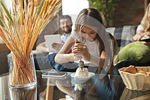 Mother, father and daughter at home having fun, comfort and cozy concept