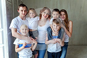 Mother, father and five children near at home