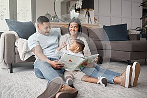 Mother, father and happy child reading books on living room floor for educational fun, learning and development at home
