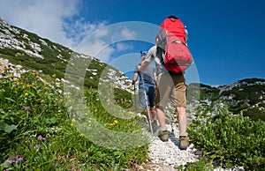 Mother and father hike with baby boy