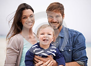 Mother, father and portrait with toddler at beach for family, love and adventure together on vacation. Happy, man and