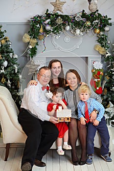 Mother, father, son and daughter hold gingerbread