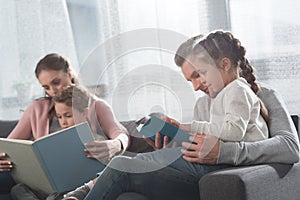 Mother and father teaching kids to read