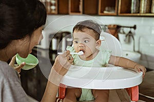 Mother feeding baby