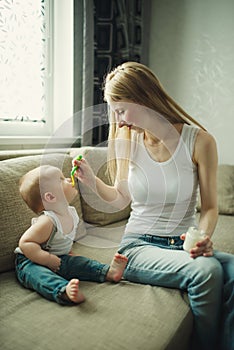 Mother feeding baby with a spoon