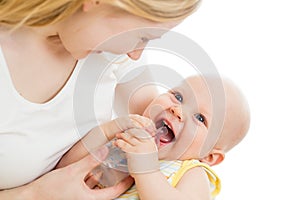 Mother feeding her adorable baby boy from bottle