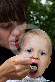 Mother feedings son