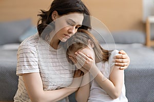 Mother is feeling sorry for a crying child