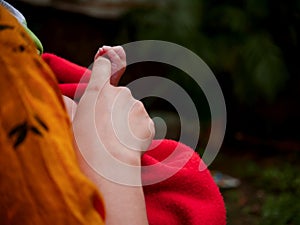 Mother finger holding by baby hand side frame loving