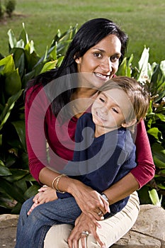 Mother with five year old son on lap