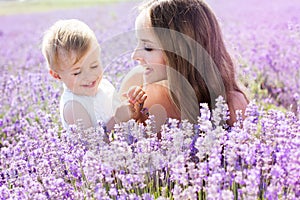 Mother and gaughter playing in lavender field