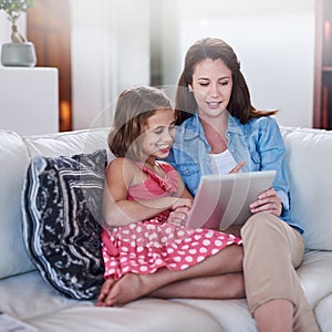 Mother, girl child and relax with tablet for streaming, elearning or online games with bonding or together at family