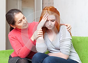 Mother gives solace to crying daughter