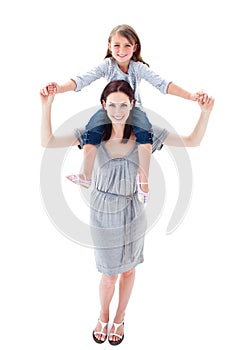 A mother giving her daughter piggyback ride