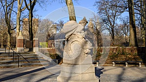 `Mother Goose` statue with `Snow Babies` in the background at the entrance to the Rumsey Playground, Central Park, New York City
