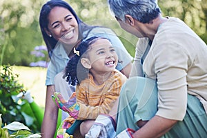 A mother, grandmother and daughter gardening together outdoor for growth or sustainability during spring. Plants, kids