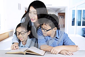 Mother guides her children to study at home